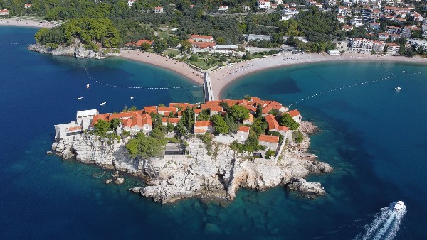 Aerial view of rocky island village and turquoise bay
